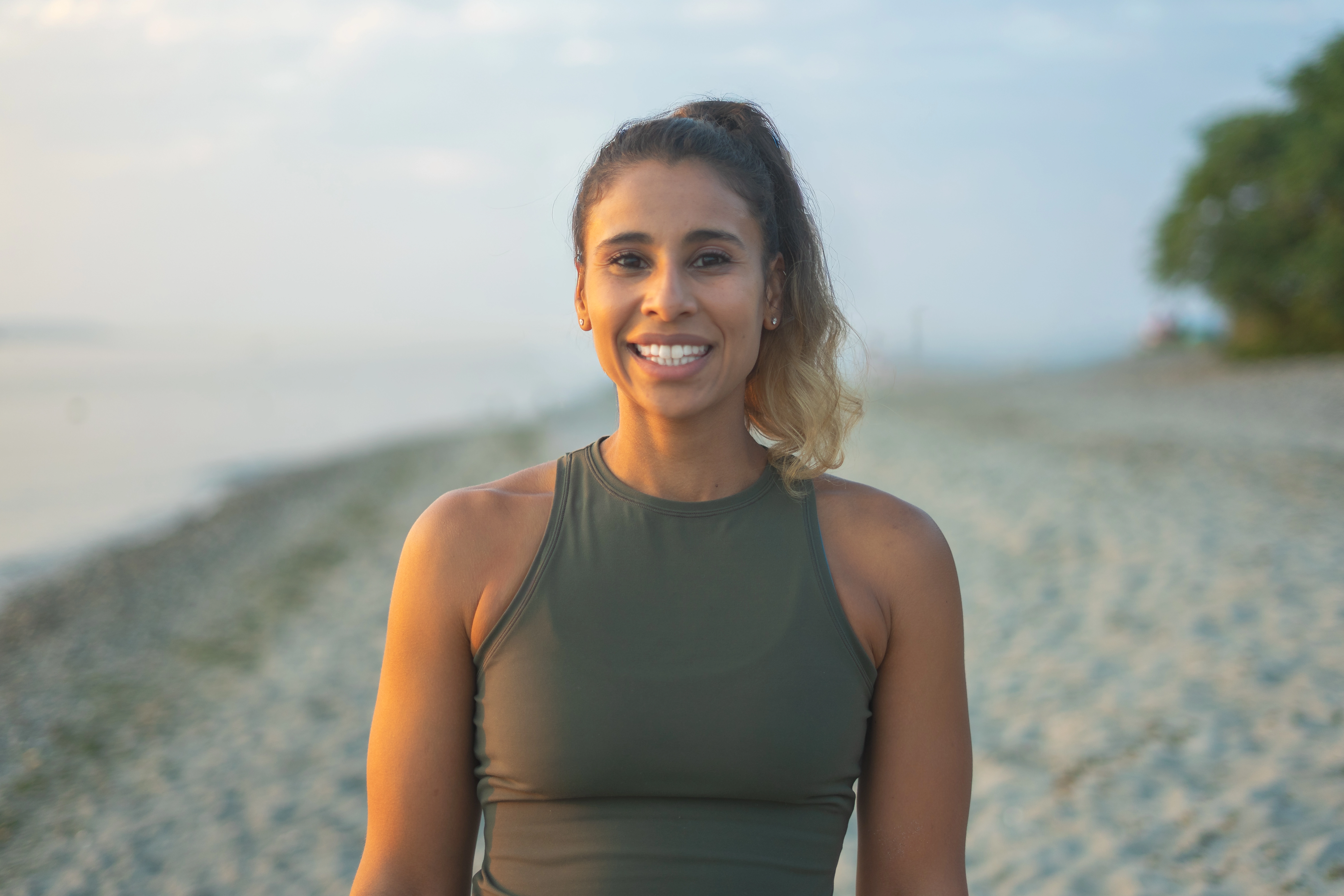 Cassie doing a headstand on the beach